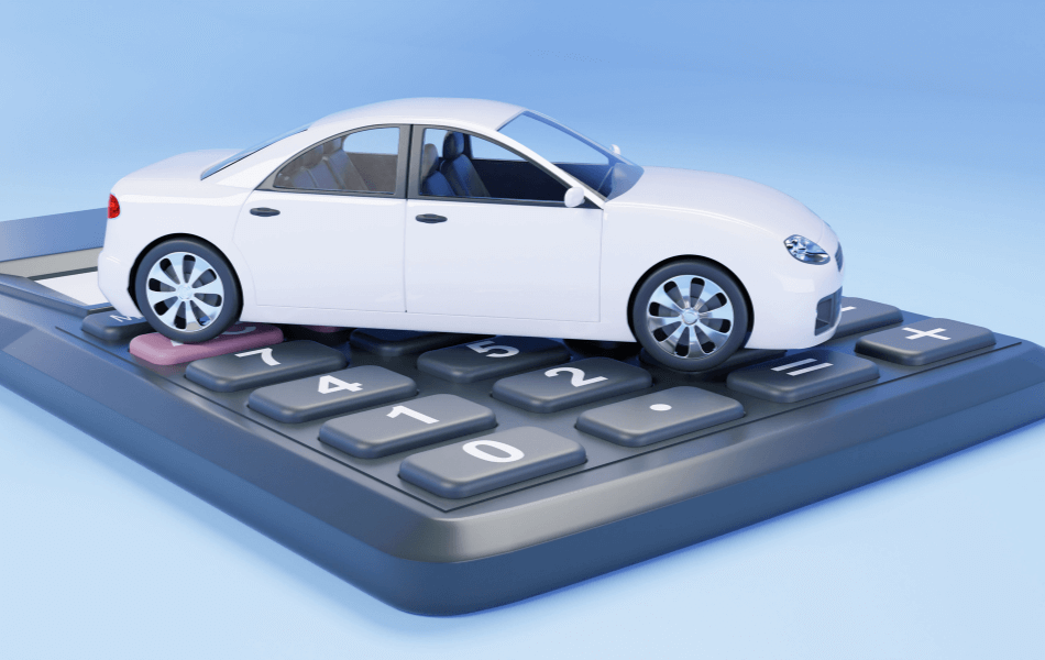 White, toy car on top of a calculator