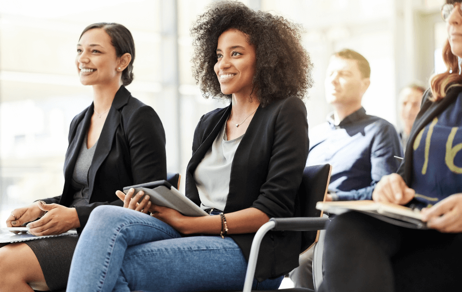 Group of people watching a presentation